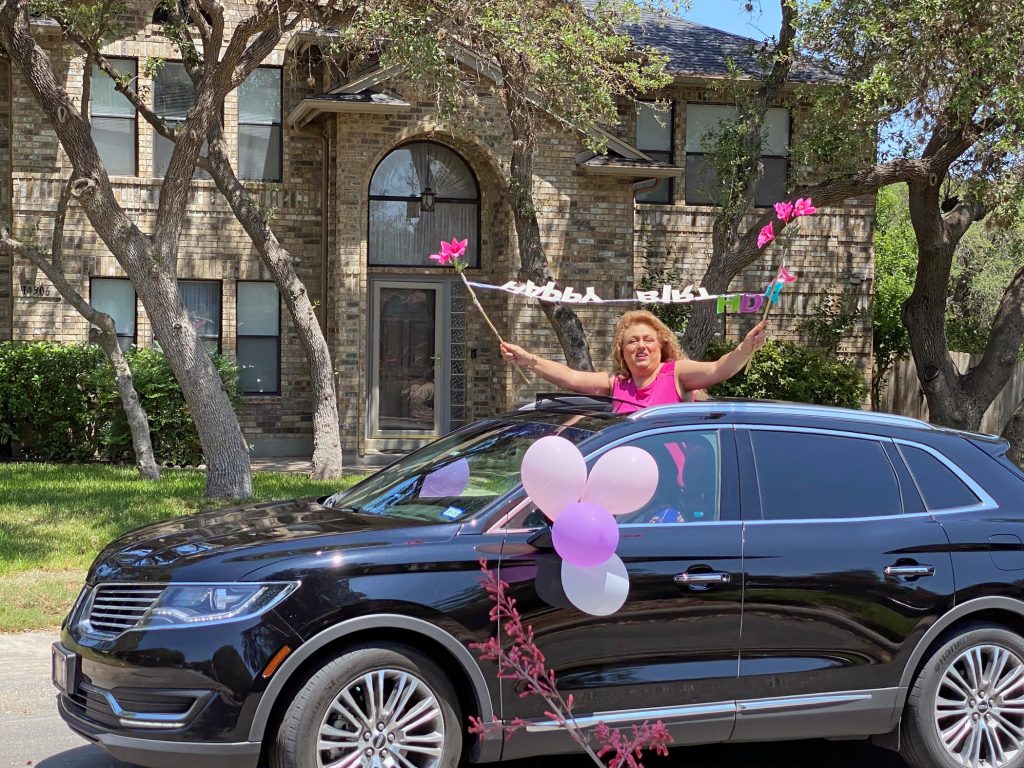 Organized car birthday parade to cheer the person who celebrates her birthday during a pandemic